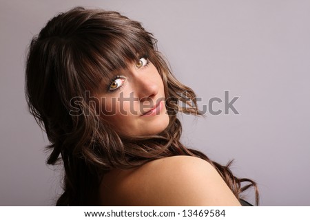 beautiful brunette with long hair and  greenish hazel eyes