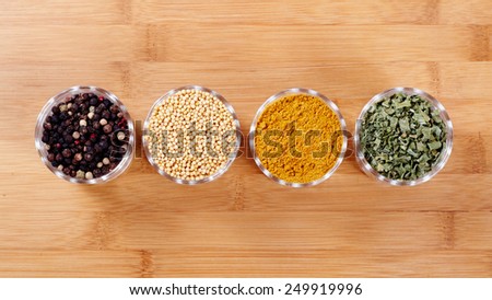 Fragrant spices. Isolated on wooden background