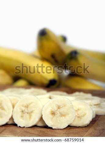 Banana slices on wooden board