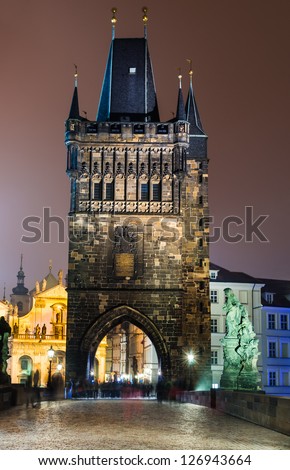 Magnificent Gothic structure called Stare Mesto Tower, was built in 14th century, fitting ornament to the new Charles Bridge (Karluv Most). Prague, Czech Republic