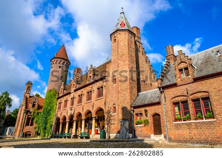 Bruges, Belgium. Medieval brickwork building in downtown historic center of Brugge, gothic city in West Flanders.