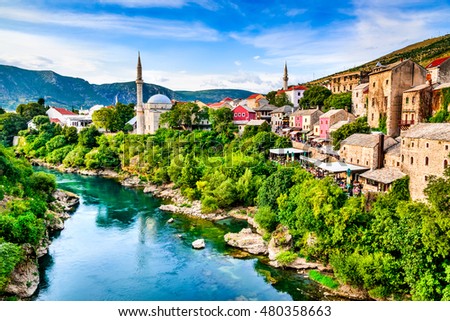 Mostar, Bosnia and Herzegovina. Morning sun on Nerteva River and Old City of Mostar, with Ottoman Mosque