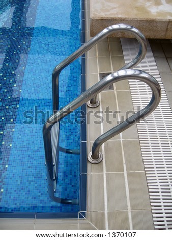 Side view of a swimming pool ladder.
