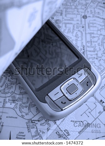 Turning over the page of a street map reveals a Smartphone PDA with GPS capability. The image is in a blue tone.