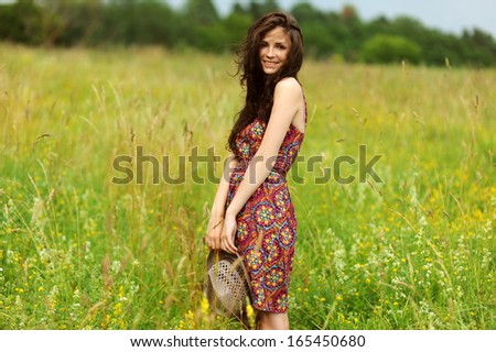 Beautiful Girl in the field. Beauty Model Woman Face with freckles.