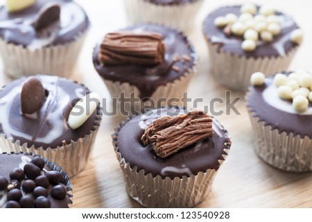 Gourmet chocolate cupcakes in silver cupcake wrappers