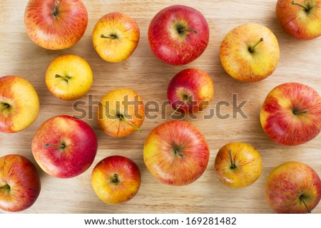 Red And Yellow Apples On Table Viewed From Above.