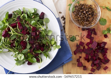 Watercress and beetroot salad with toasted sunflower seeds.
