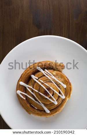Cinnamon roll from above, can be vertical or horizontal.