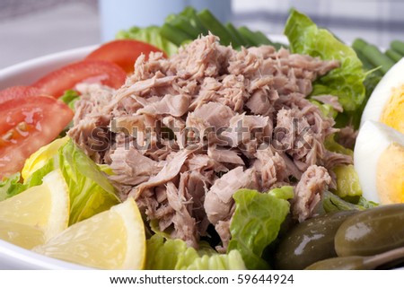 Close up of a salad Nicoise with flaked tuna.