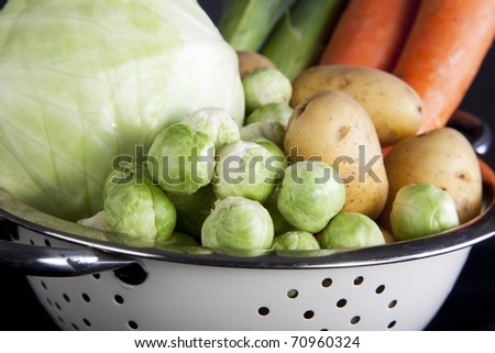 Dutch winter vegetables including carrots, potatoes, brussel sprouts, cabbage and leeks. Focus on the brussel sprouts