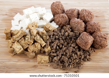Various vegetarian products, raw tofu, marinated tofu, ground and ball soy protein.