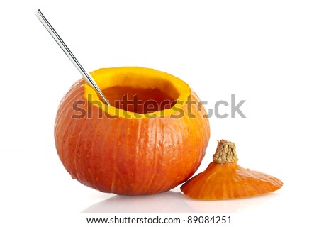 Pumpkin, with top remove and seeds cleaned out, isolated on a white background.