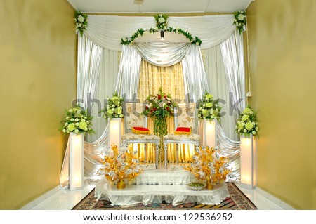 traditional wedding stage with yellow decoration