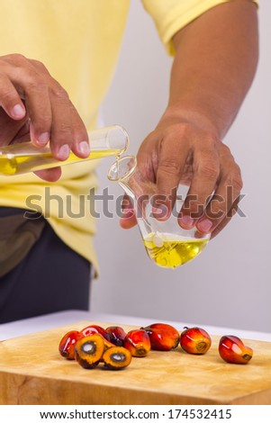 pure palm oil pouring into a test tube glass