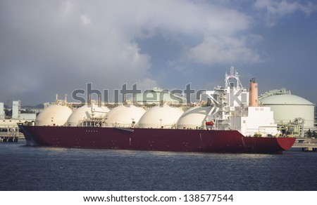 Gas tanker loading in port, Japan