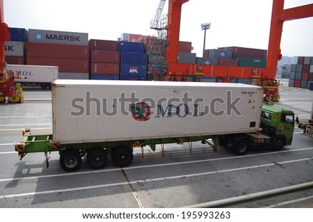 HO CHI MINH, VIETNAM - SEPTEMBER 23 : Container truck waiting for loading refrigerator container box to Cargo ship at Ho Chi Minh port in Vietnam, Vietnam is leader food export in asia, on September 23 , 2013