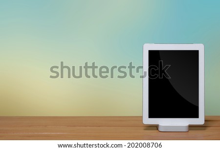 tablet pc computer with dock station on blur background.