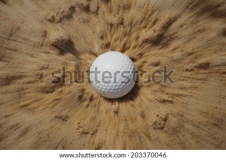 Golf ball impact to sand trap, motion blur