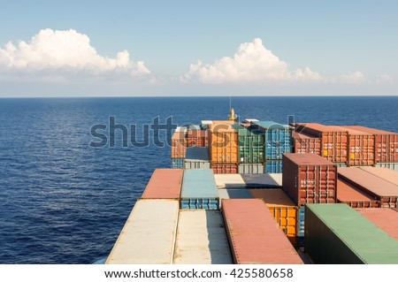 Large container ship move forward to ocean, evening day time.