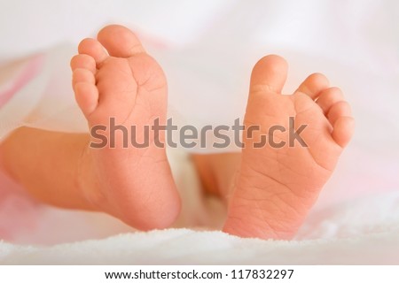 Cute and soft baby feet close-up