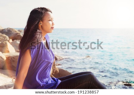 Gorgeous young lady relaxing near the water