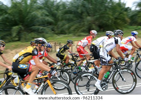 MELAKA,MALAYSIA - FEBRUARY 26 : The largest group of cyclists from various teams cycle during Stage 3 of the Tour de Langkawi from Melaka to Parit Sulong on February 26, 2012 in Melaka, Malaysia.