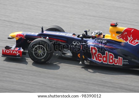 SEPANG, MALAYSIA - MARCH 23: Close -up Sebastian Vettel of Red Bull Racing in action during Petronas Malaysian Grand Prix practice session at Sepang F1 circuit on March 23, 2012 in Sepang, Malaysia.