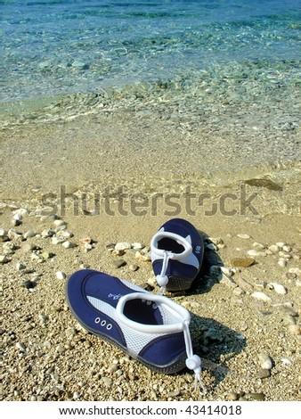 Swim Shoes  Women on Swimming Shoes On The Beach Stock Photo 43414018   Shutterstock