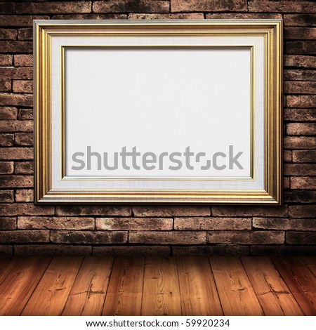 gold picture frame on brick wall and wood floor