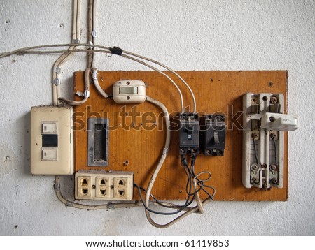 old dirty Electrical in wood panel on wall