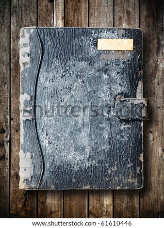 Old black binder of panel wood