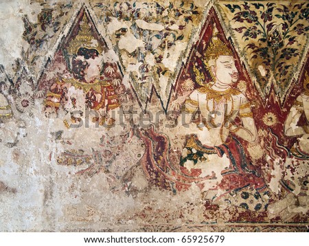 Ancient old art form to write a wall with three faces of angel, Thailand