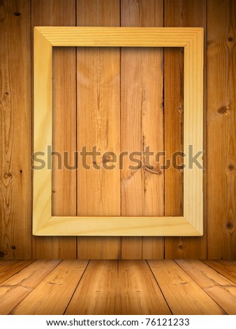 Wood picture frame on wood panel with shadow