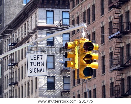 A left turn signal turns yellow in New York City.