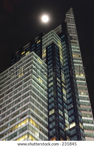 Times square building at night with moon