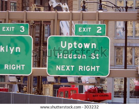 Manhattan Sign Series - Uptown. A sign directs traffic to uptown Manhattan, New York City.