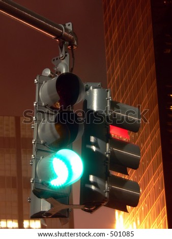 Traffic Signal at Night -- Stop and Go.  Red and Green lights on a signal