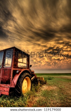 Storm Clouds Saskatchewan with antique vintage tractor