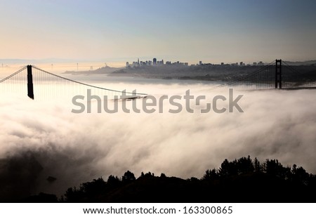 San Fransisco Skyline with fog rolling in during morning sunrise
