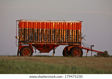 Colorful grain wagon in scenic Saskatchewan