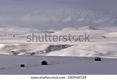 Buildings in winter with Rocky Mountains in background