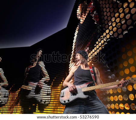 guitar player on concert with huge led screen background