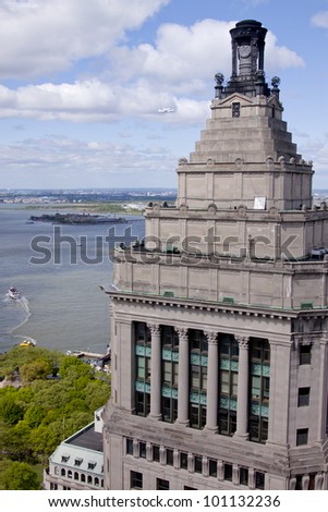 NEW YORK - Oct 8: The space shuttle Enterprise mounted on NASA\'s 747 Shuttle Carrier Aircraft flies north along the Hudson River with the Standard Oil Bldg in the foreground on October 8, 2011 in NYC.