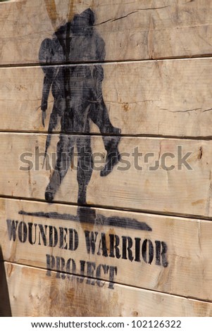 POCONO MANOR, PA - APR 29: The Wounded Warrior Project logo painted on Berlin Walls obstacle at Tough Mudder on April 29, 2012 in Pocono Manor, PA.  The course is designed by British Special Forces.