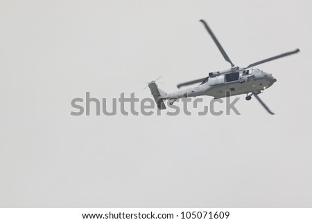 HOBOKEN, NJ - MAY 23: A military helicopter flies along the Hudson River near Manhattan during the Parade of Sails on May 23, 2012 in Hoboken, NJ. The parade marks the beginning of Fleet Week.