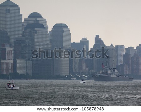 HOBOKEN, NJ - MAY 23: USS Gonzalez (DDG 66) goes past the World Trade Center in Lower Manhattan during the Parade of Sails on May 23, 2012 in Hoboken, NJ. The parade marks the start of Fleet Week.