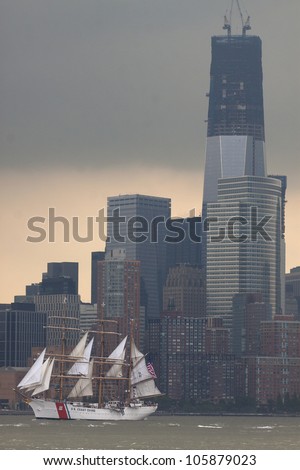 HOBOKEN, NJ - MAY 23: The USCGC Eagle (WIX 327) sails on the Hudson River past the World Trade Center during the Parade of Sail on May 23, 2012 in Hoboken, NJ. The parade is the start of Fleet Week.