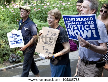 NEW YORK - JUNE 22: Supporters holding signs calling for equality and justice march through Washington Square Park on the 8th Annual Trans Day of Action on June 22, 2012 in New York City.