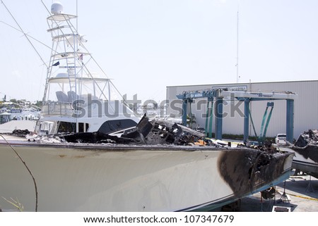 STUART, FL - MARCH 30: The charred fiberglass hull of a boat now in dry dock at the Sailfish Marina in Stuart, Florida on March 30, 2011. Two boats were destroyed in the fire.